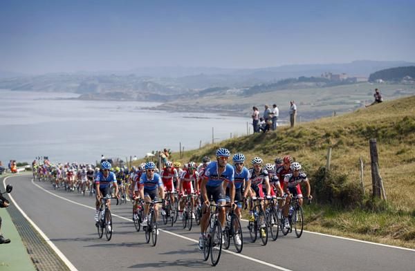 Garmin-Sharp sets tempo in the peloton to keep a large breakaway in check.