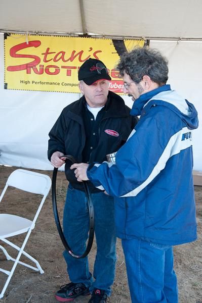 Stan Koziatek of Stan's NoTubes and Richard Cunningham discuss one of Stan's wheels at the Kona 24 Hours in the Old Pueblo expo area.