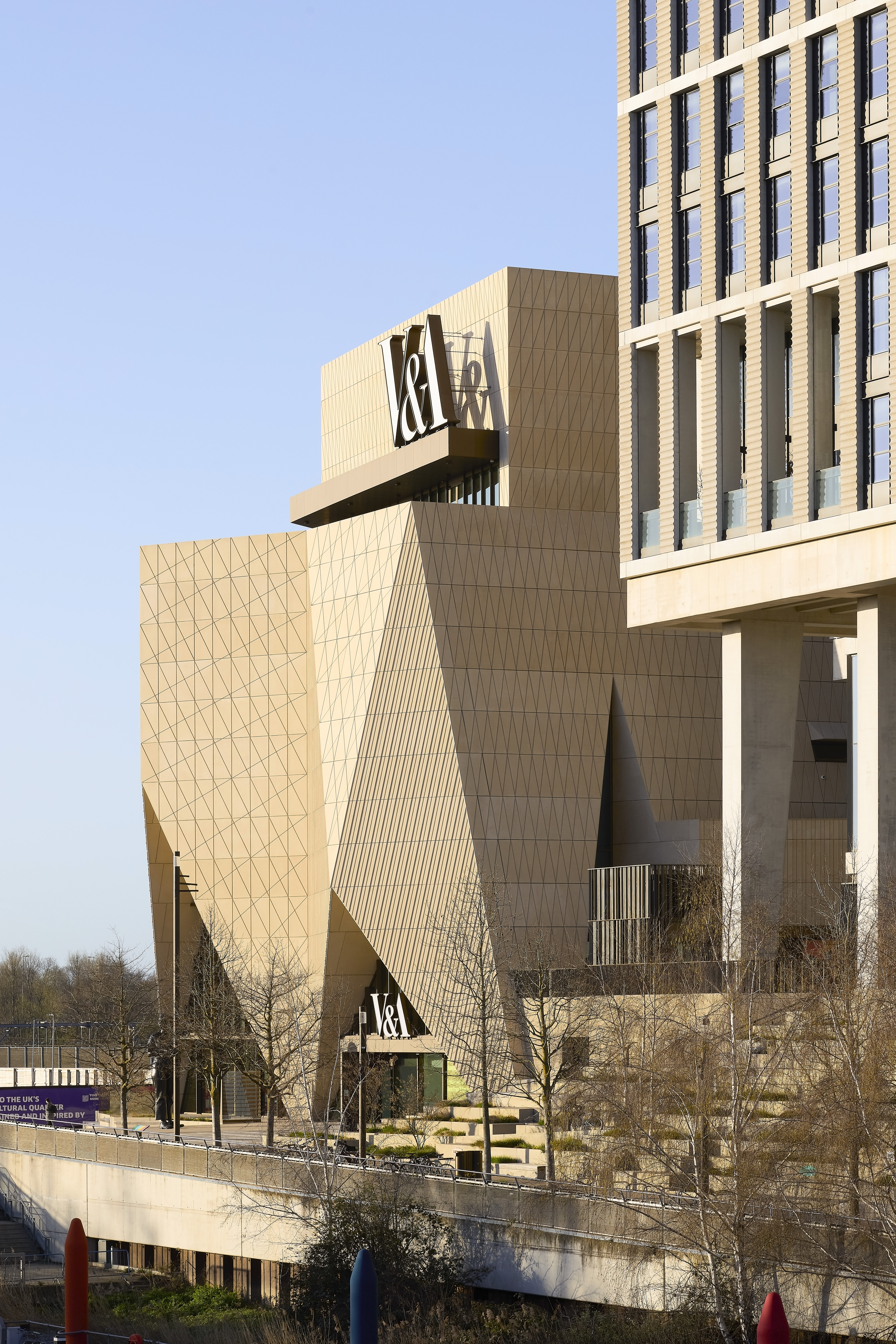 exterior views of V&amp;amp;A East Museum, with its faceted patterned facade