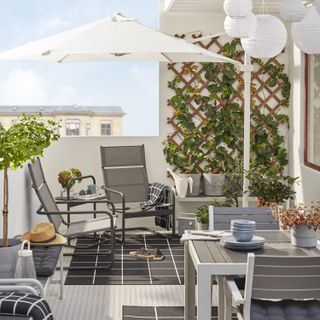 trellis on a balcony with modern furniture and outdoor rugs