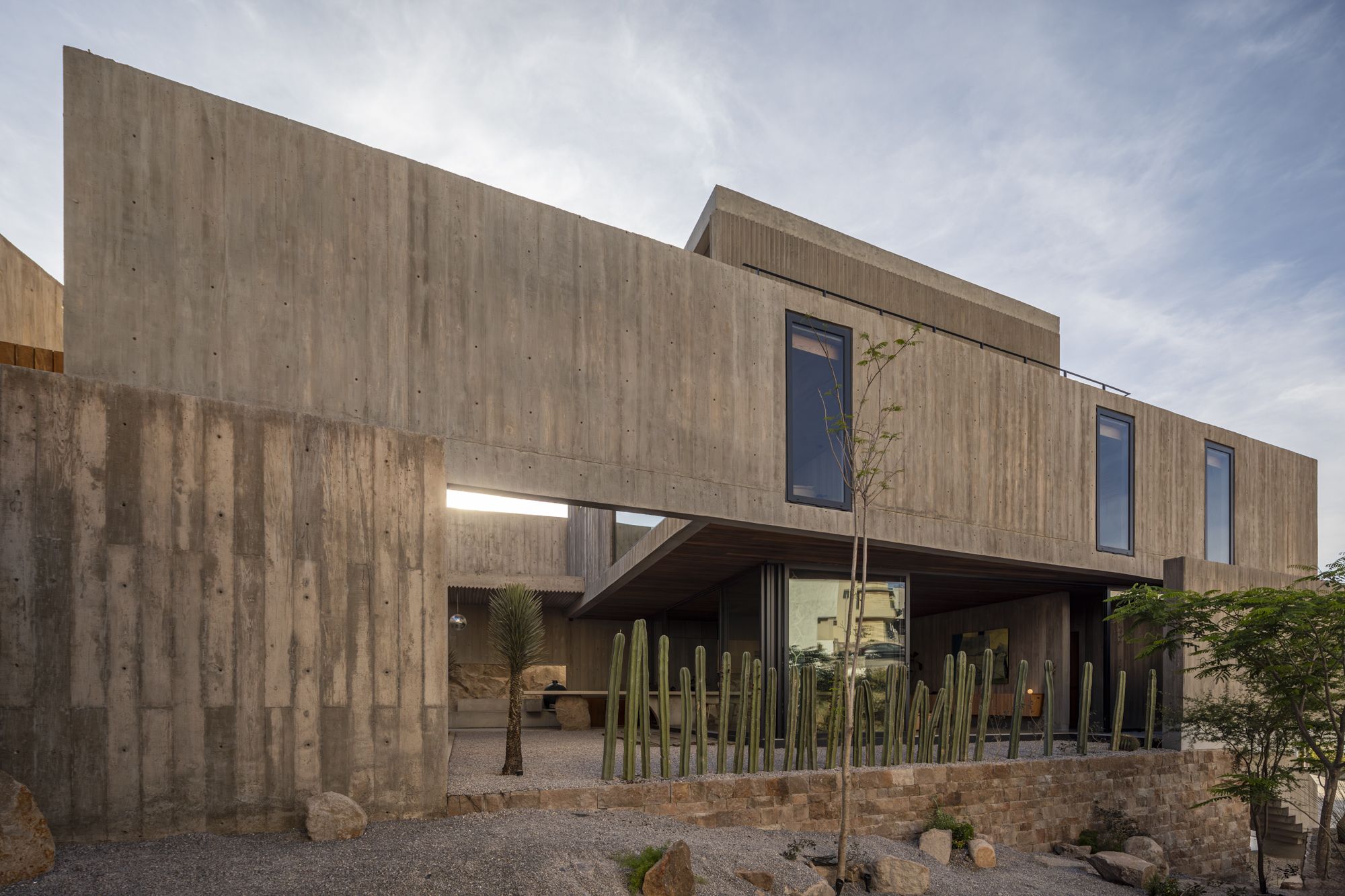 Rocky outcrops and cactus walls define this Mexican home on the edge of the desert