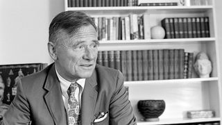 Christopher Isherwood in his study