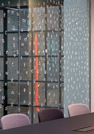 Noto scripts on glass with working table