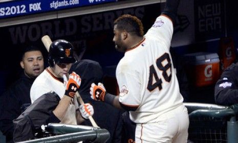 Pablo Sandoval #48 of the San Francisco Giants celebrates with a curtain call after hitting a solo home run in Game 1 of the World Series against the Detroit Tigers. Sandoval went on to hit t