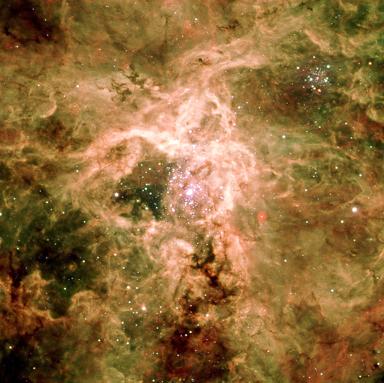 The core of the Tarantula Nebula, the largest and most intense star-forming region in the Large Magellanic Cloud, imaged here by the VLT in 2003.