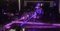To make this quantum gas atomic clock, researchers used multiple lasers to cool strontium atoms and trap them in a grid of light. Then, a blue laser beam excites the cube-shaped cloud of the atoms. 