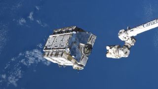 a large white rectangle floats above the blue surface of earth