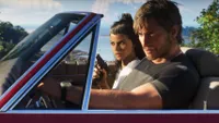 GTA 6 screenshot showing protagonists Lucia and Jason in a convertible. 