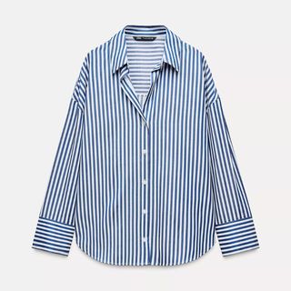 A cutout of a white and blue Zara stripe shirt set against a white background