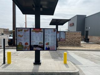 A fast-food drive-thru menu powered by PDG digital signage solutions.