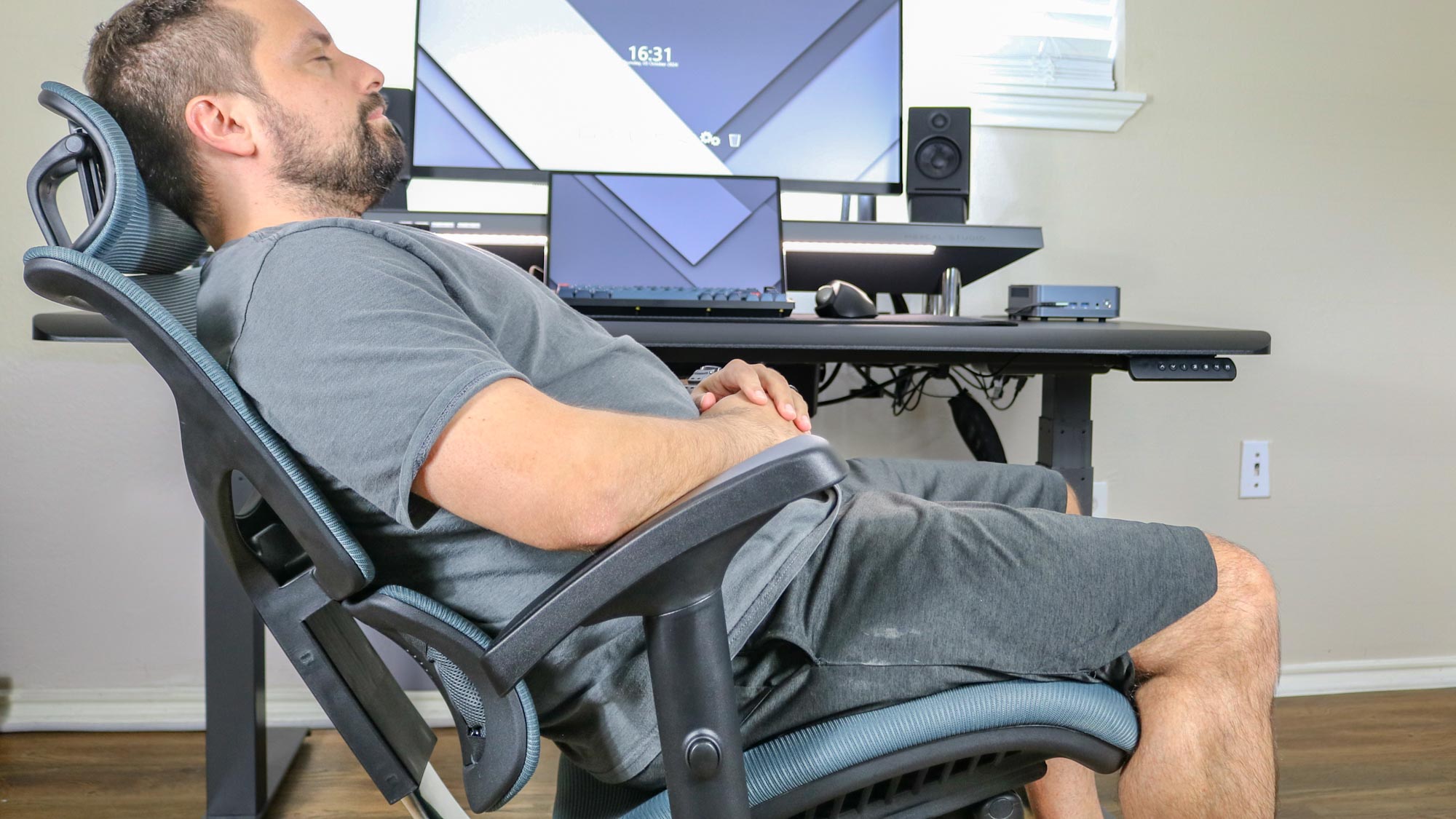 A person reclining in the X-Chair X3