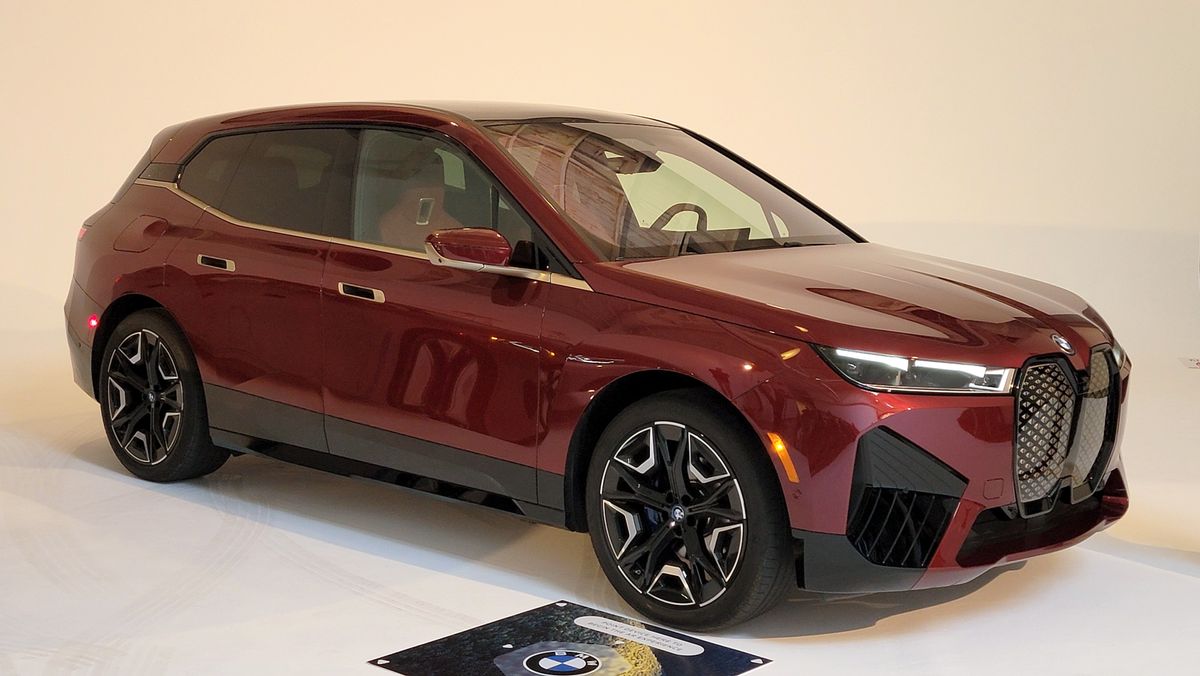 BMW iX sitting in a showroom