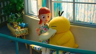 A Psyduck snuggles up to Haru in Pokémon Concierge.