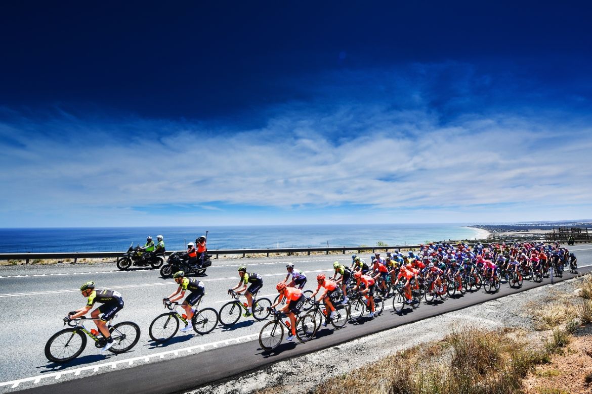 The peloton makes its way along the coast