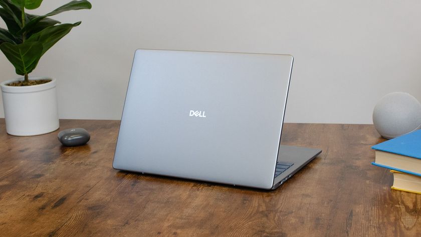 A Dell 14 Plus on a desk with its lid facing outward