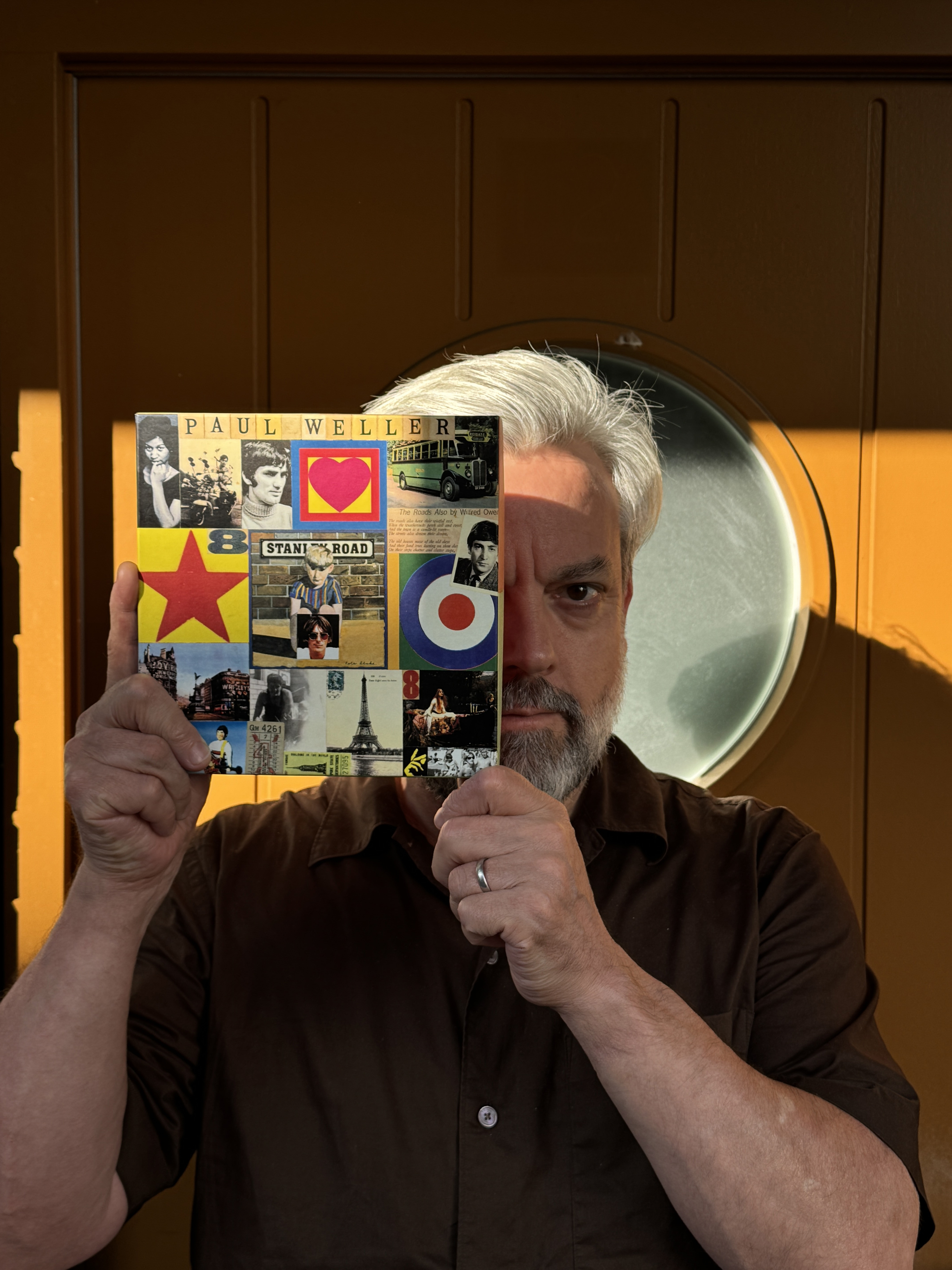 Paul Blackburn holding up a book