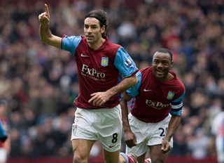 Robert Pires of Aston Villa celebrates with team mate Nigel Reo Coker during the FA Cup sponsored by E.On Fourth Round match between Blackburn Rovers at Villa Park on January 29, 2011 in Birmingham, England.