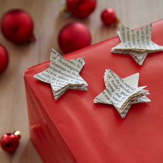 newspaper stars with red decorative balls