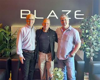 Blaze Audio and C&C Tech leaders stand in unity after partnership.