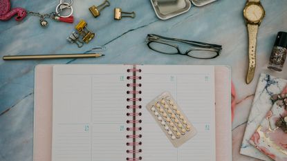 Notebook with various bits and bobs