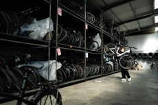 An employee works at the warehouse of the E-bike company in Vienne near Lyon on March 28, 2023