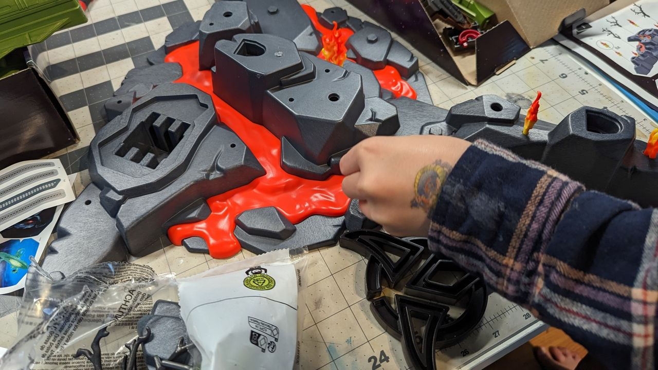a box of playmobil parts on a table