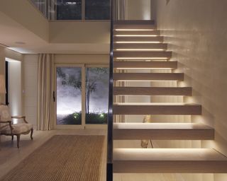 Underlit staircase lighting ideas in hallway by John Cullen Lighting