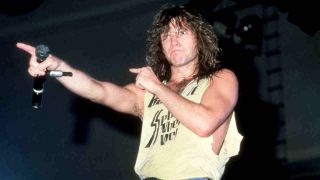 Jon Bon Jovi performing onstage in 1986