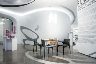 Flowing interior of Roca gallery exhibition, featuring Zaha Hadid Design