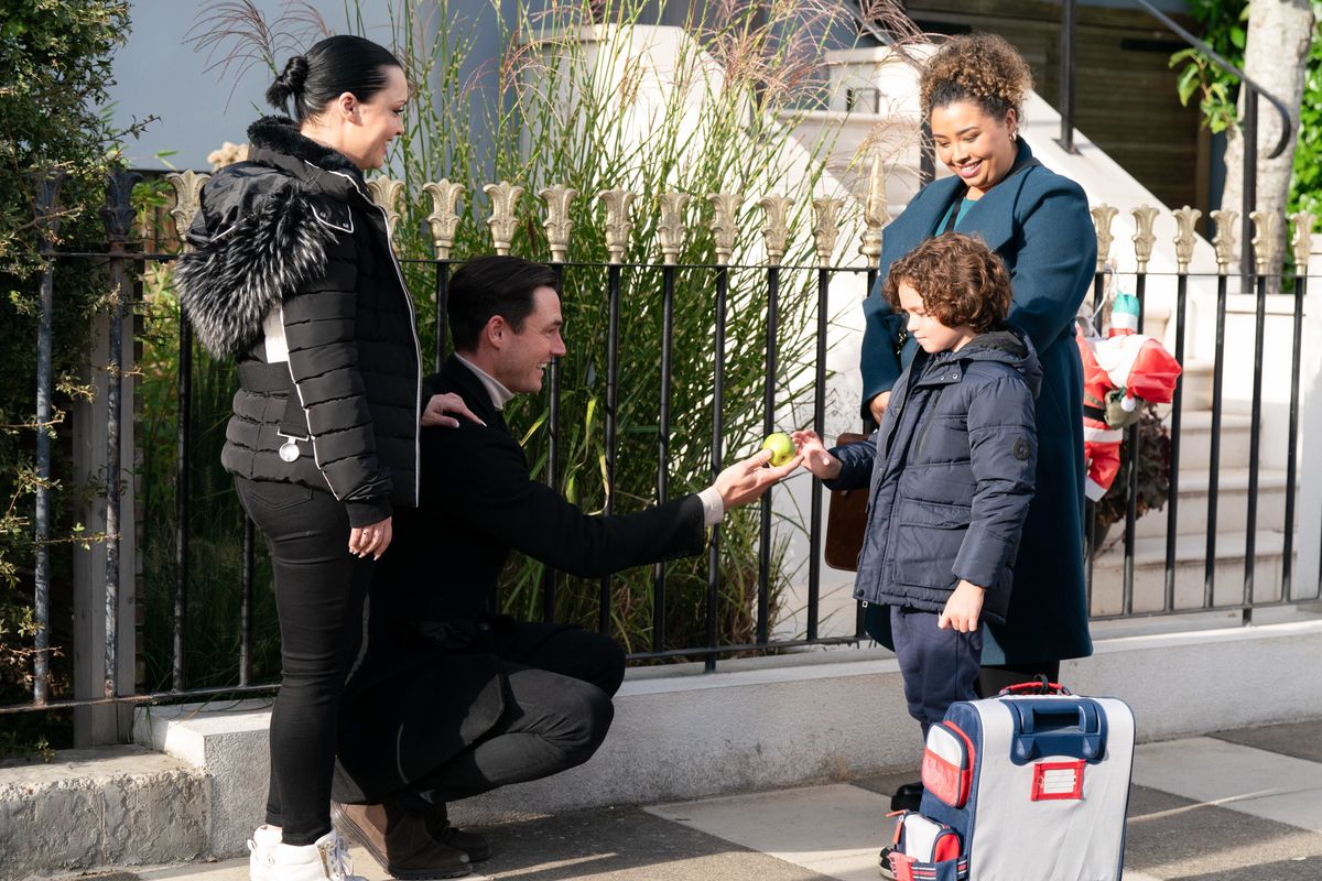 Whitney Dean and Zack Hudson with foster child Ashton