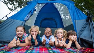 Five children in a tent