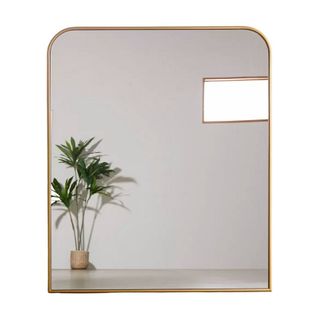 An extra large gold framed mirror