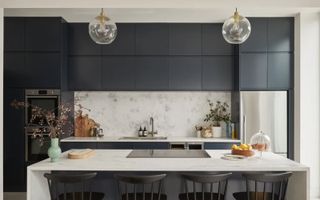 dark grey kitchen with marble worktops