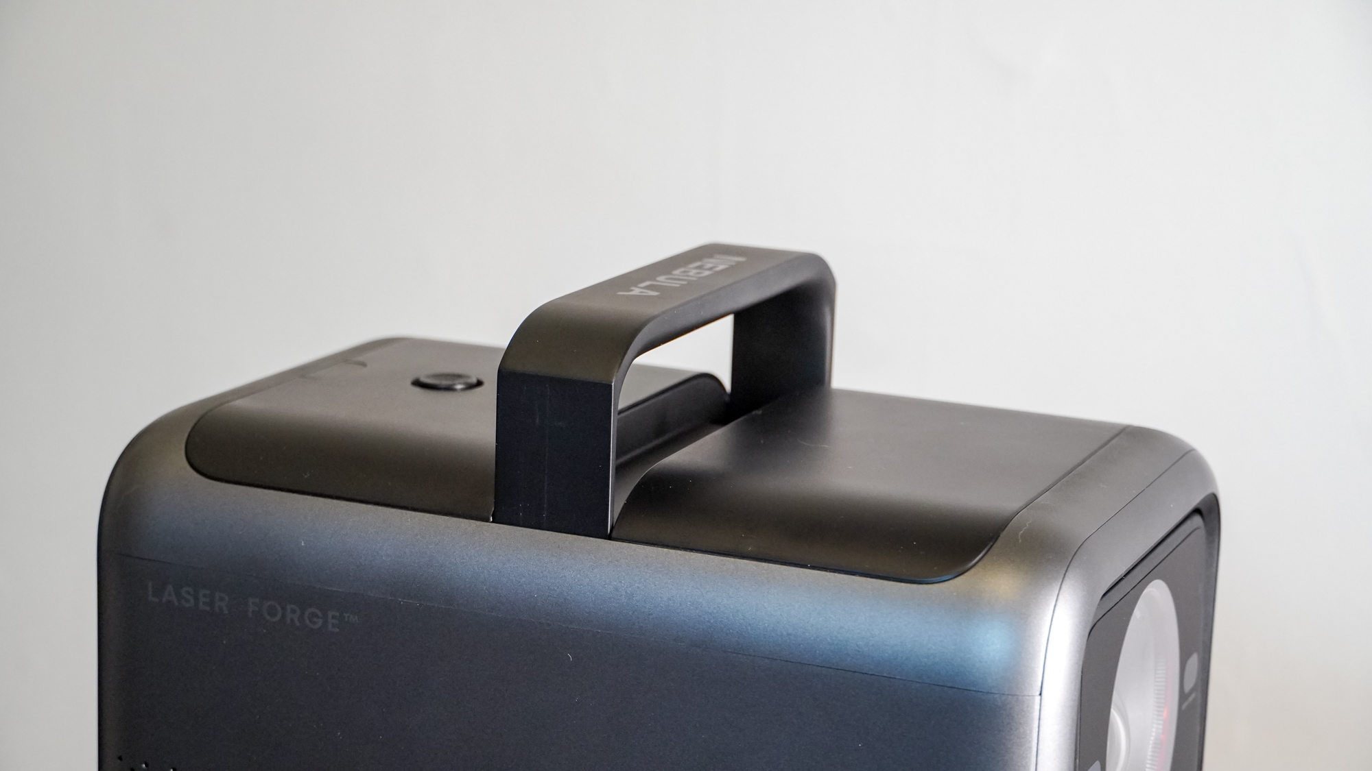 The pop-up handle on an Anker Nebula X1 projector.