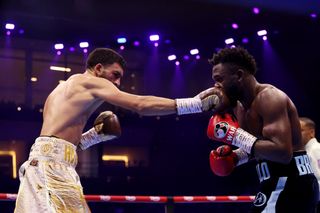 Hamzah Sheeraz punches Carlos Adames during the WBC World Middleweight Title fight between Carlos Adames and Hamzah Sheeraz as part of Beterbiev v Bivol 2: The Last Crescendo at Kingdom Arena on February 22, 2025 in Riyadh, Saudi Arabia.