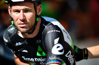 Mark Cavendish cradles his arm after crashing during stage 4 at the Tour de France