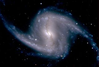 the barred spiral galaxy NGC 1365, in the Fornax cluster of galaxies