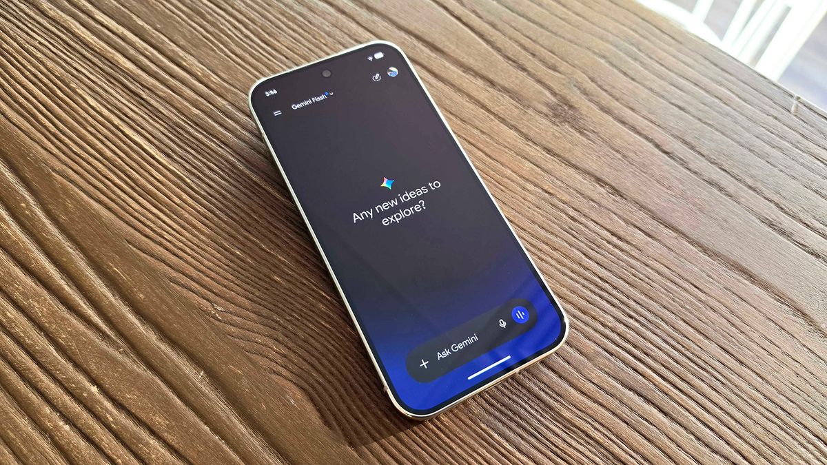 Google Pixel 11 Pro laying on table with Gemini app asking