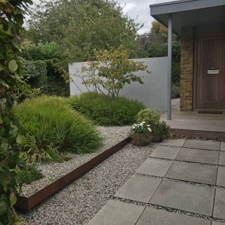 low maintenance front garden idea, with shrubs in a garden border