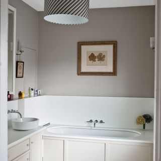 bathroom with grey wall and classic fixtures