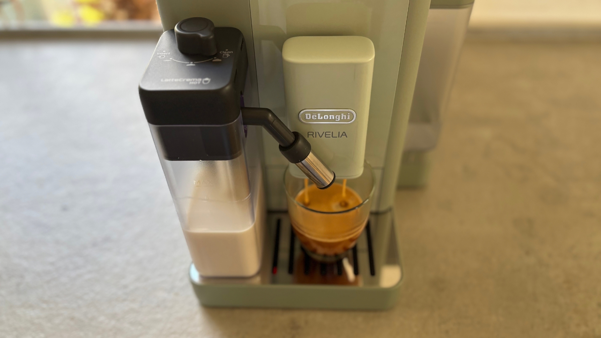De'Longhi Rivelia Start Coffee Machine on the counter making a coffee