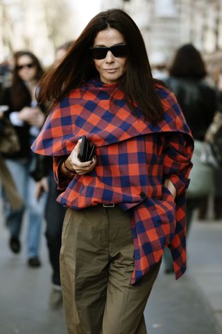 Woman in plaid jacket and pants