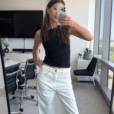 Judith Jones in black top and white jeans