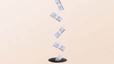 Wasted business investment concept image showing stacks of dollar bills falling into a black hole in the ground.