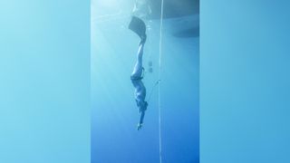 A free diver while descending.