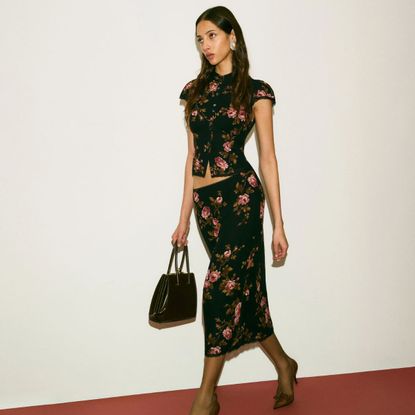 a model wears a reformation floral two-piece set