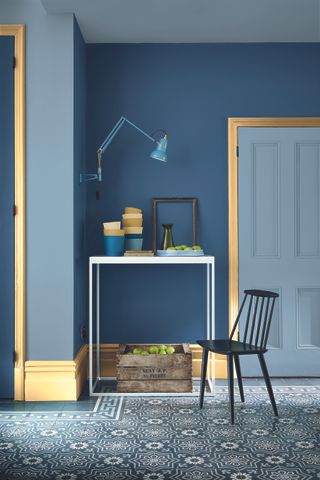 A blue room with yellow trim