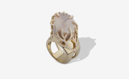 Marble ring surrounded by small diamonds