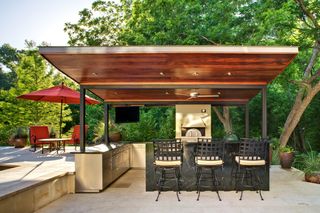 A backyard with a fitted outdoor kitchen