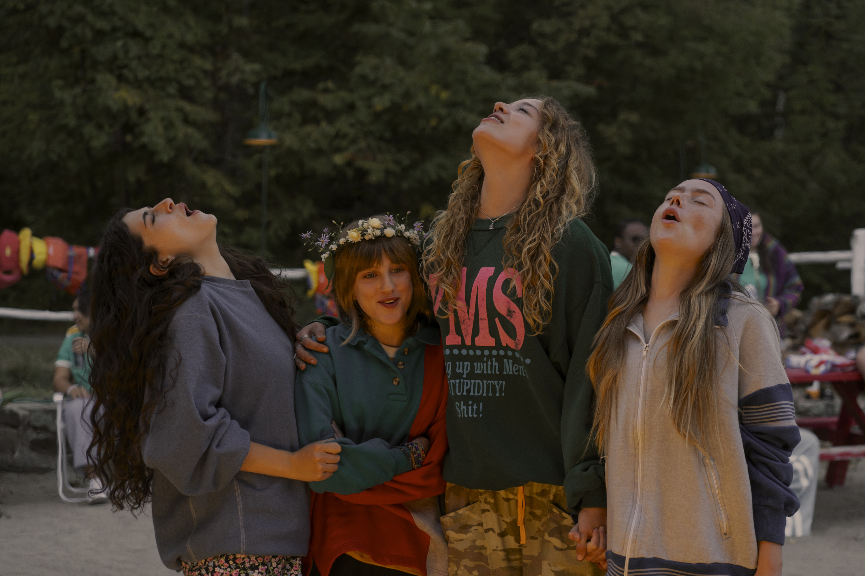 Four teen girls (l-r Ella Rubin as Annie, Mabel Strachan as Maple, Bo Bragason as Oona, and Ame&amp;#769;lie Hoeferle as Ramona) howl while standing in a group outdoors, in the Prime Video series 'Sterling Point.'